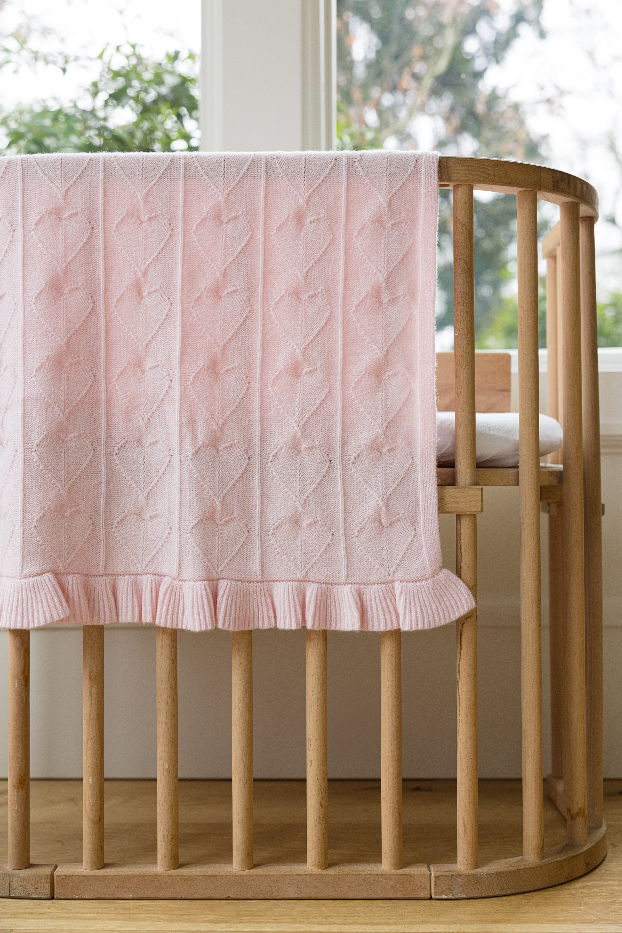 Little Love Blanket - Peony – AU Baby cashmere merino blanket, natural, non-toxic, luxury baby gift draped on a bassinet