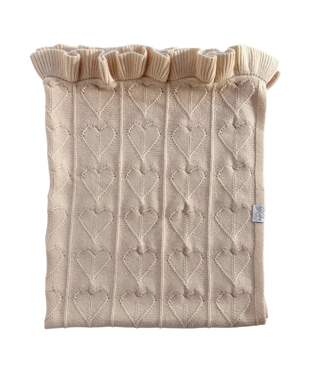 Organic AU Baby Little Love cashmere merino luxury baby blanket in color Butter Cream. GOTS + OEKOTEX certified cozy blanket with heart and ruffle details.