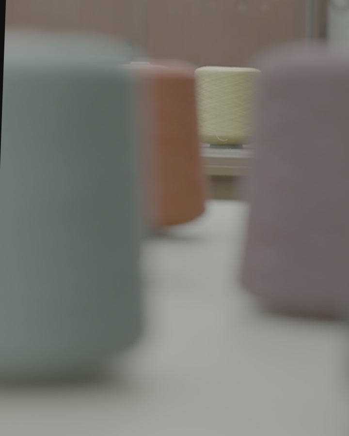 Video showing ethically raised merino sheep in Patagonia, plant-based dye materials, fine merino wool fibers, and AU Baby blankets crafted for comfort and sleep.